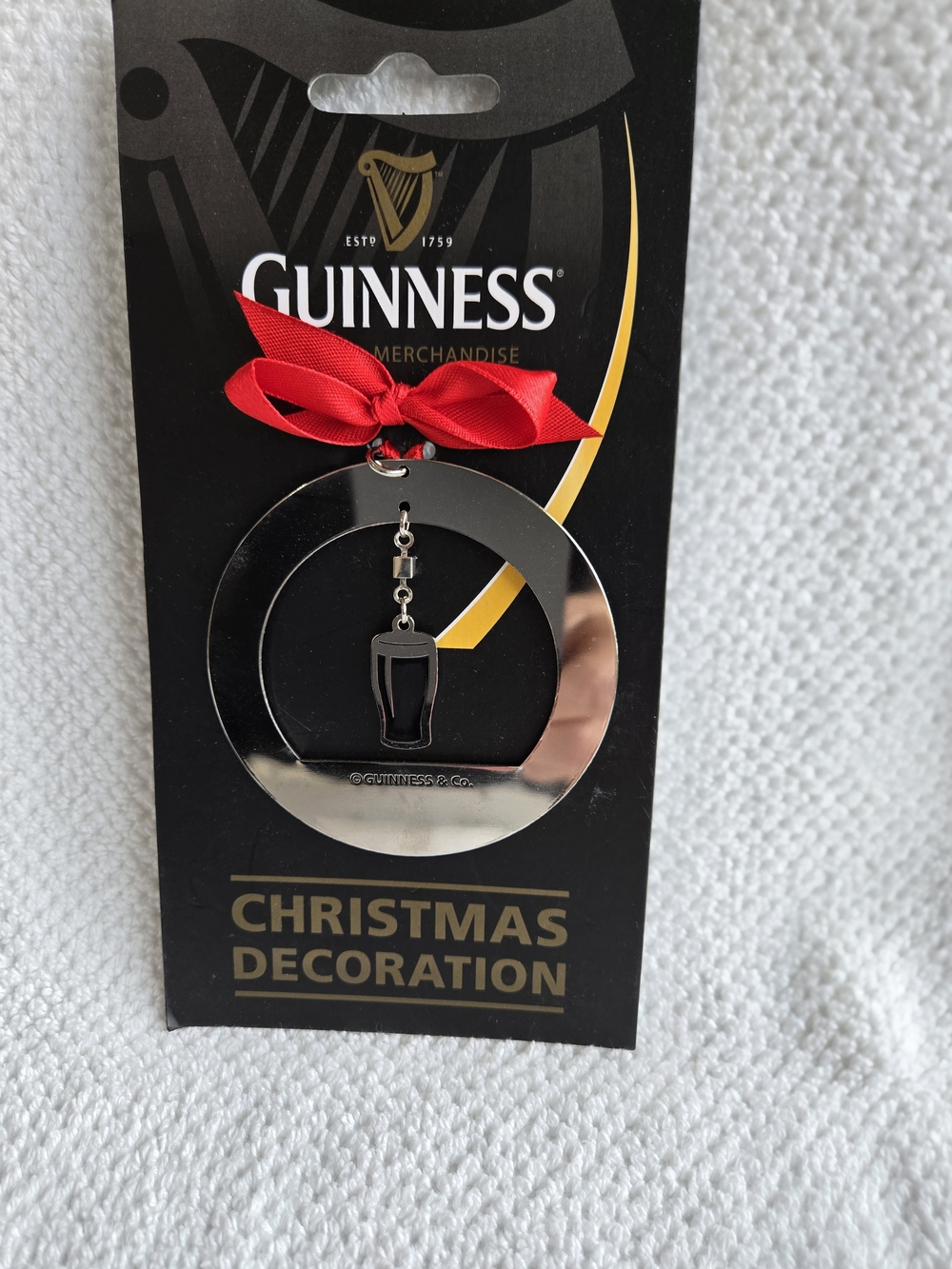 Guinness Silver Ornament with Red Bow
